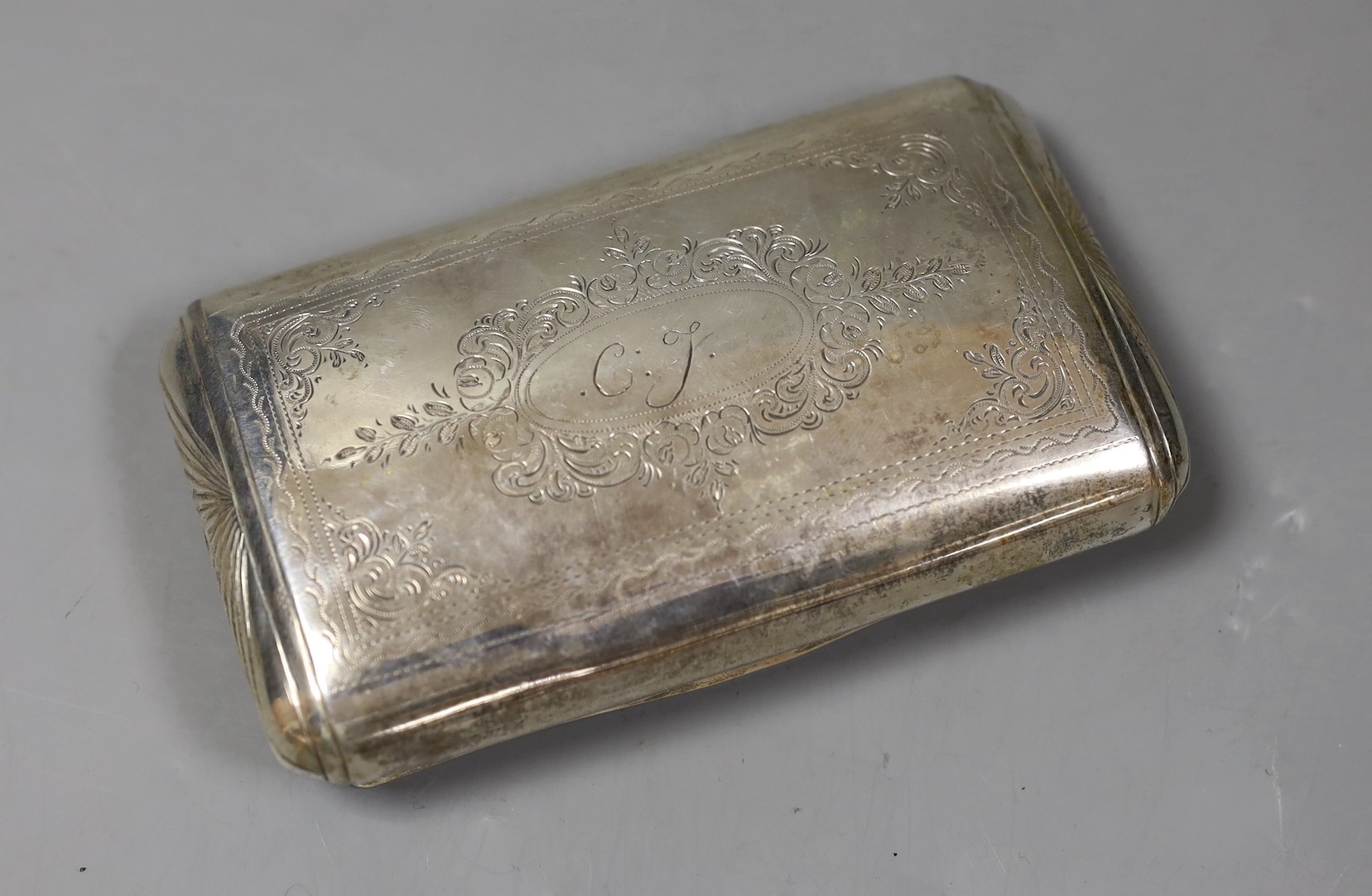 A 19th century Dutch 833 standard white metal tobacco box, engraved with a church in landscape scene, 13.2cm, 159 grams.